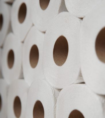 Toilet paper roll accumulation on production line. background